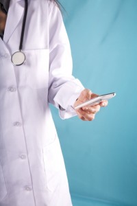 female doctor with smartphone