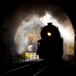 Train steaming into a tunnel