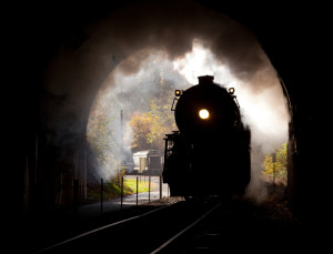 Train steaming into a tunnel