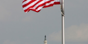 American flag flying over Capitol